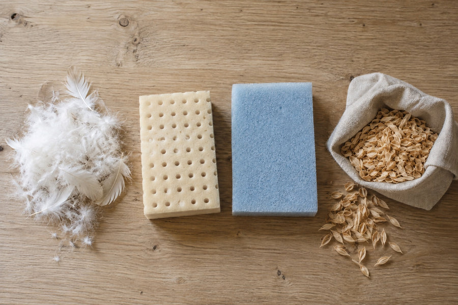 Pillow materials side by side: down feathers, latex, blue foam, spelt husks